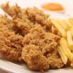 Pieces of pure chicken breast, marinated in our magic blend, covered in a super-crispy golden coating on the outside and tender and juicy on the inside. Served hot with French fries and your favorite sauce.
